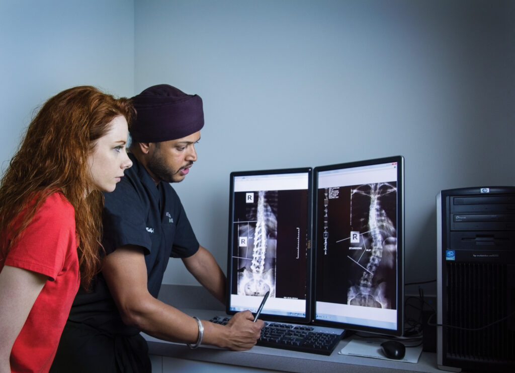 doctors looking at spine xray